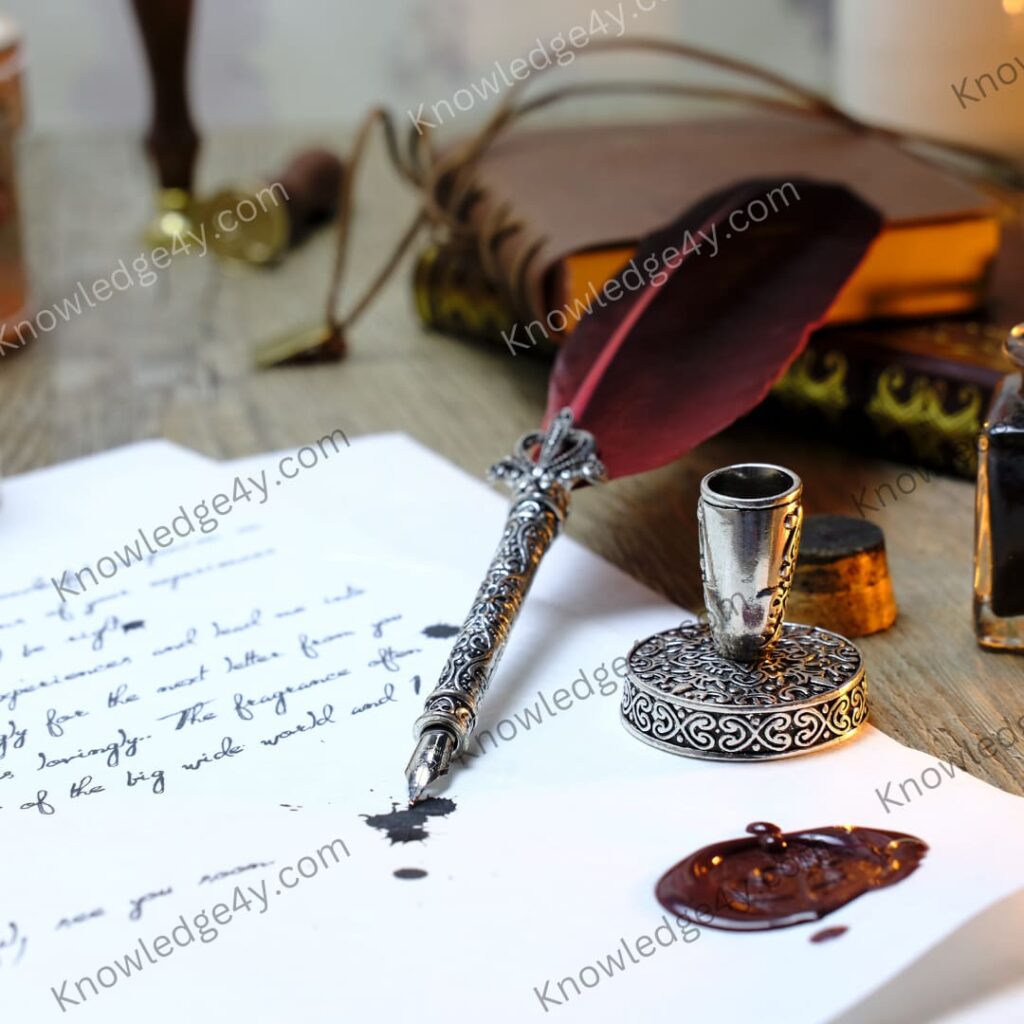 a quill pen and inkwell on a paper