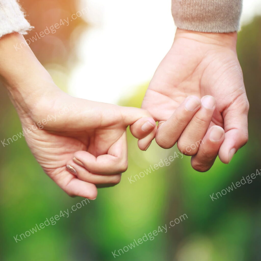 a close up of a couple hands