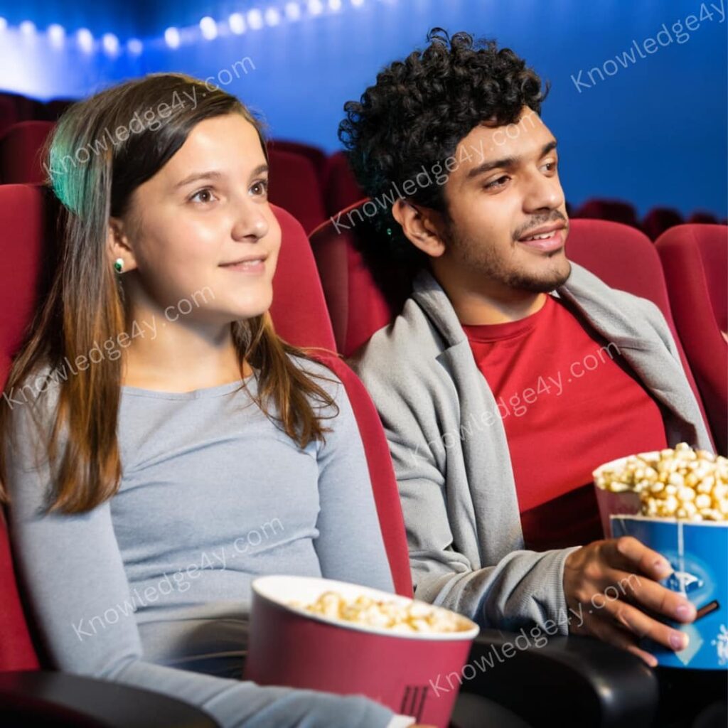Sister and brother witching movie in the cinema hall